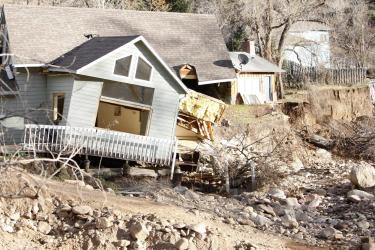 A house sits destroyed nearly two months after heavy flooding west of Lyons, Colo. (Robert R. Denton/CU News Corps)