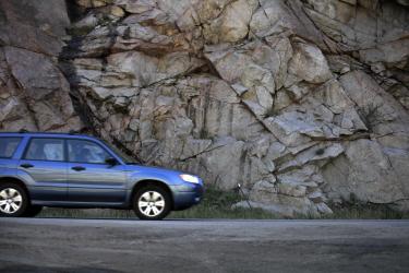 A driver makes her way down the recently re-opened Highway 119 in Boulder Canyon. (Robert R. Denton/CU News Corps)