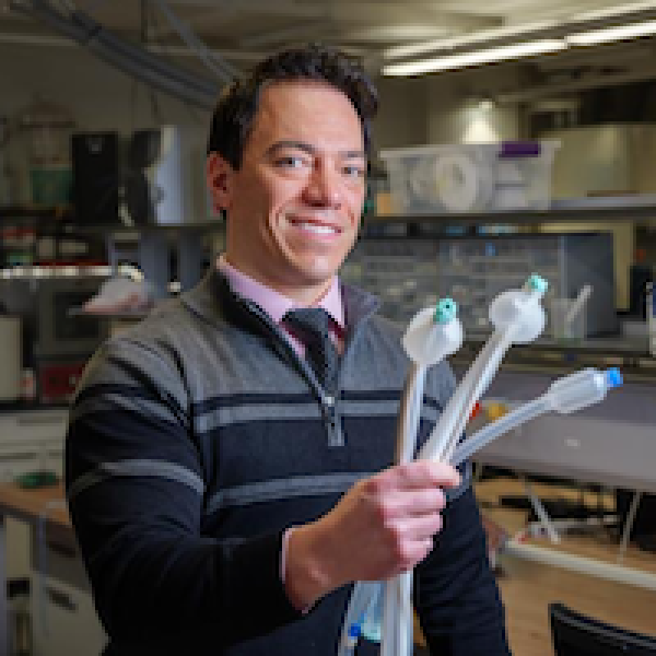 CU Boulder Professor Mark Rentschler showcasing medical devices in Aspero Medical's multi-product platform.