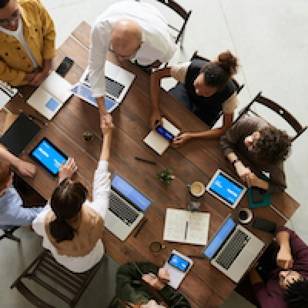 A business meeting, viewed from above.