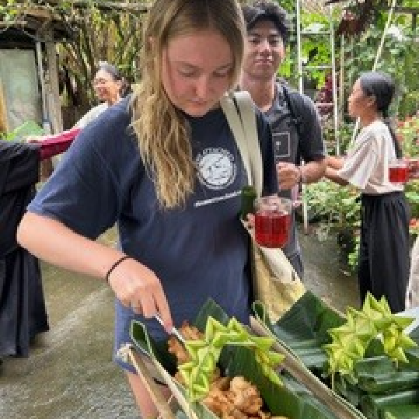 Students serving food in Bali, Indonesia