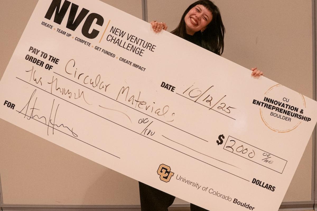 CU Boulder student Diyora Daminova holding her check for the 2025 Colorado Sustainability Challenge