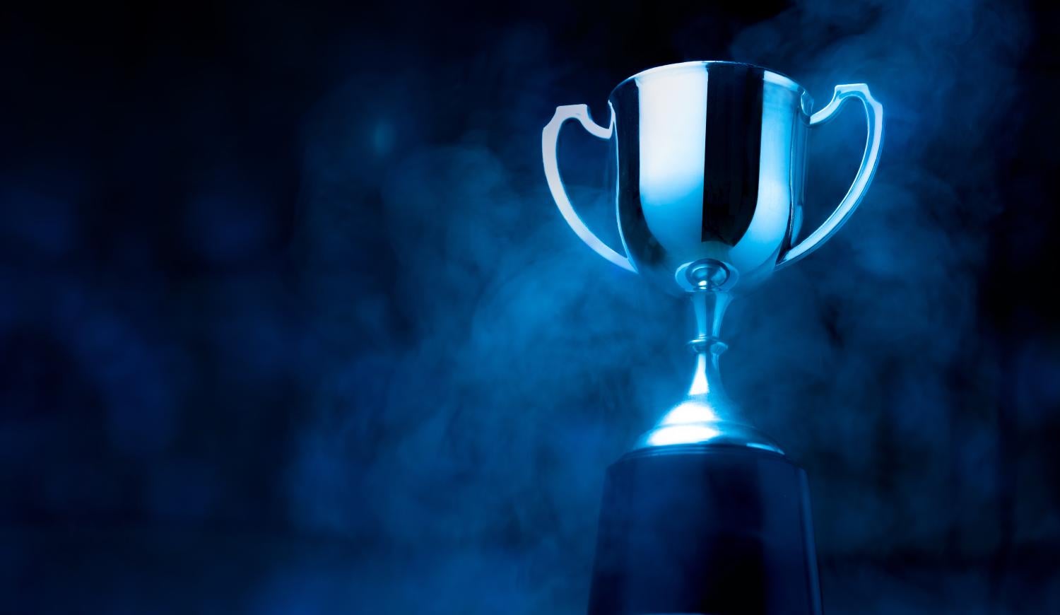 Trophy on a blue stand and background