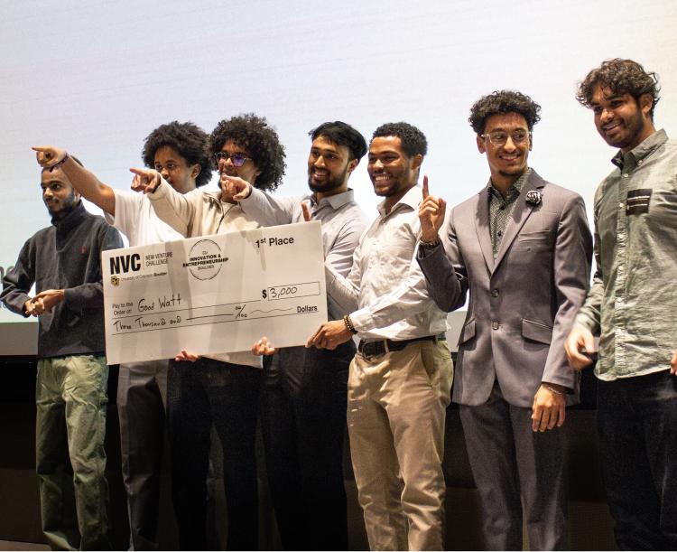 Members of the Good Watt team holding their check from the 2025 Sustainability Hackathon