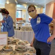 nurse in mask with food