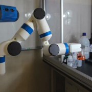 Robotic arm holds a flask