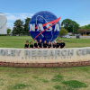 female engineering team in front of NASA sign