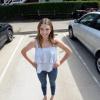 girl standing in parking spot