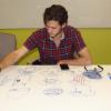 tim visos-ely drawing at a table
