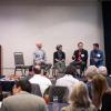 five speakers on stage