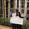 kartwheel holding big check