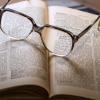 glasses on top of a book