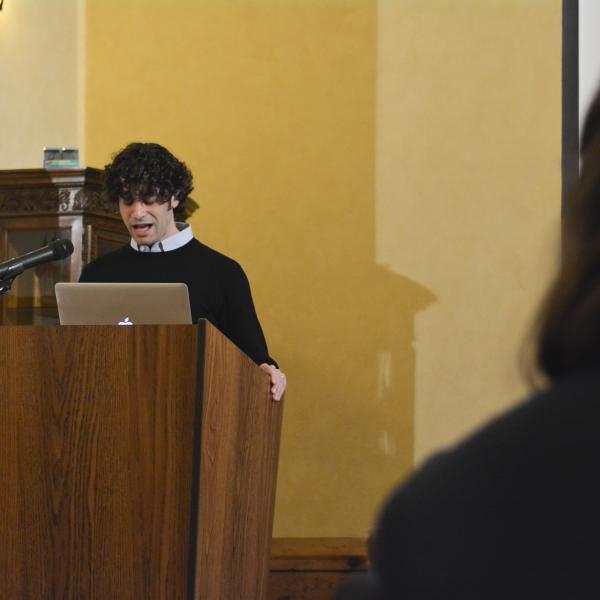 Post-doctoral fellow, Moshe Kornfeld, leads participants in an opening song.