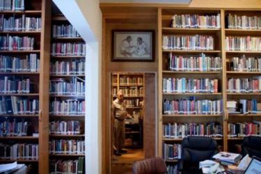 Harry Mazal pictured with part of his Holocaust library in Texas