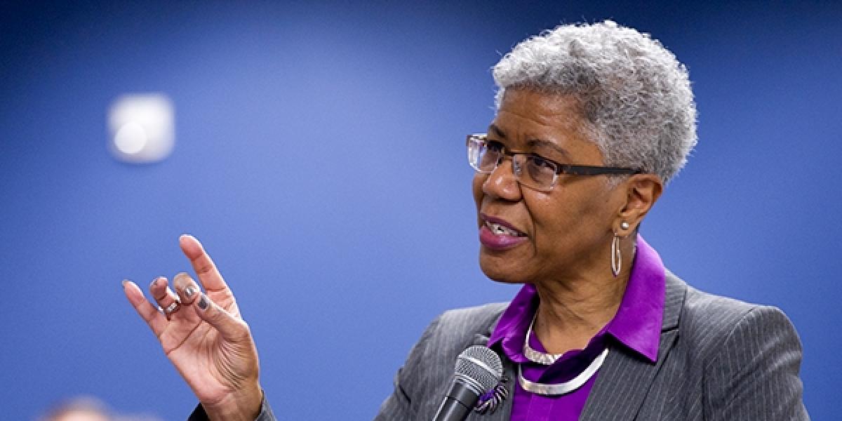 Professor Emerita Brenda J. Allen giving a talk