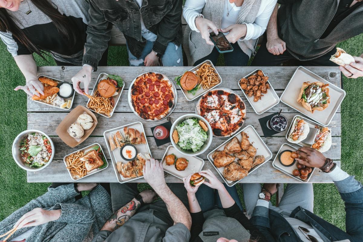 Overhead view of people eating at a picnic table