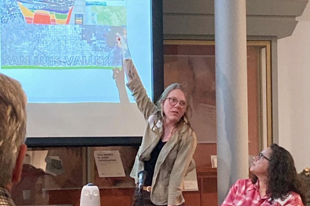 Jocelyn Catterson and Holly Barnard do a joint slide presentation about dwindling groundwater in the San Luis Valley