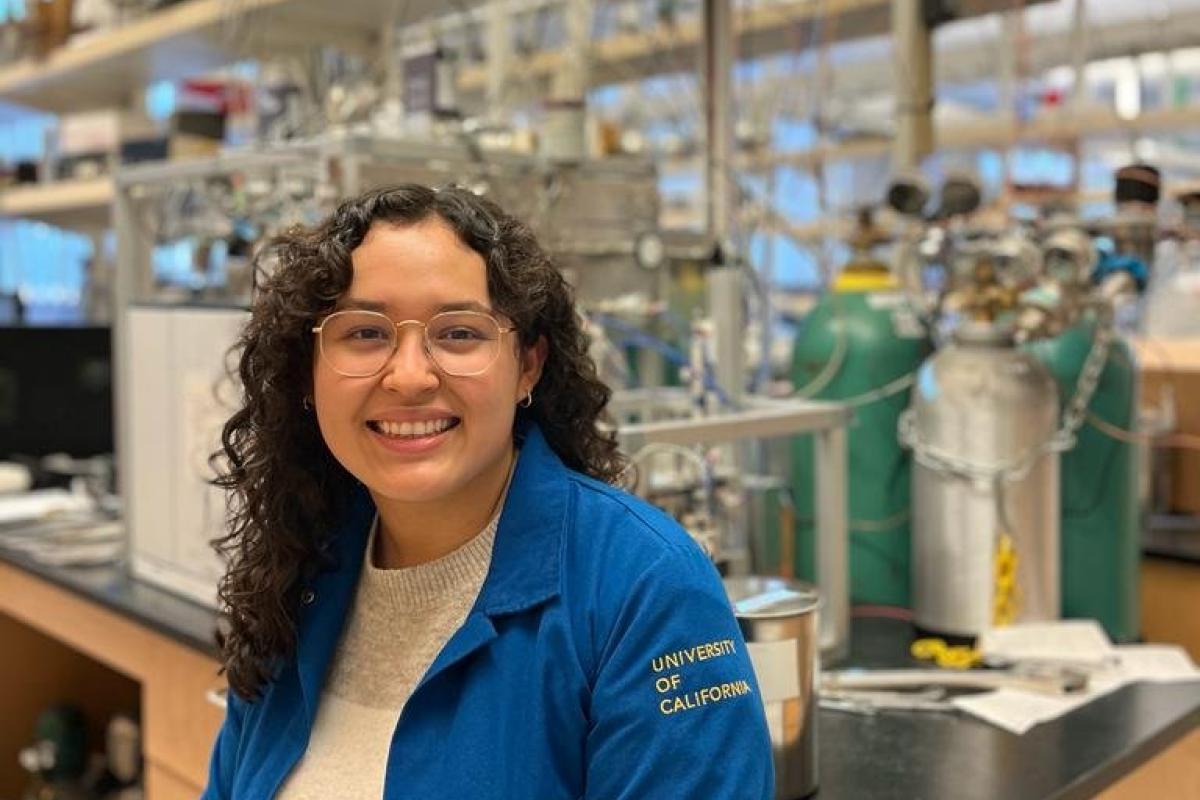 Denise Mondragon stands in a chem lab.