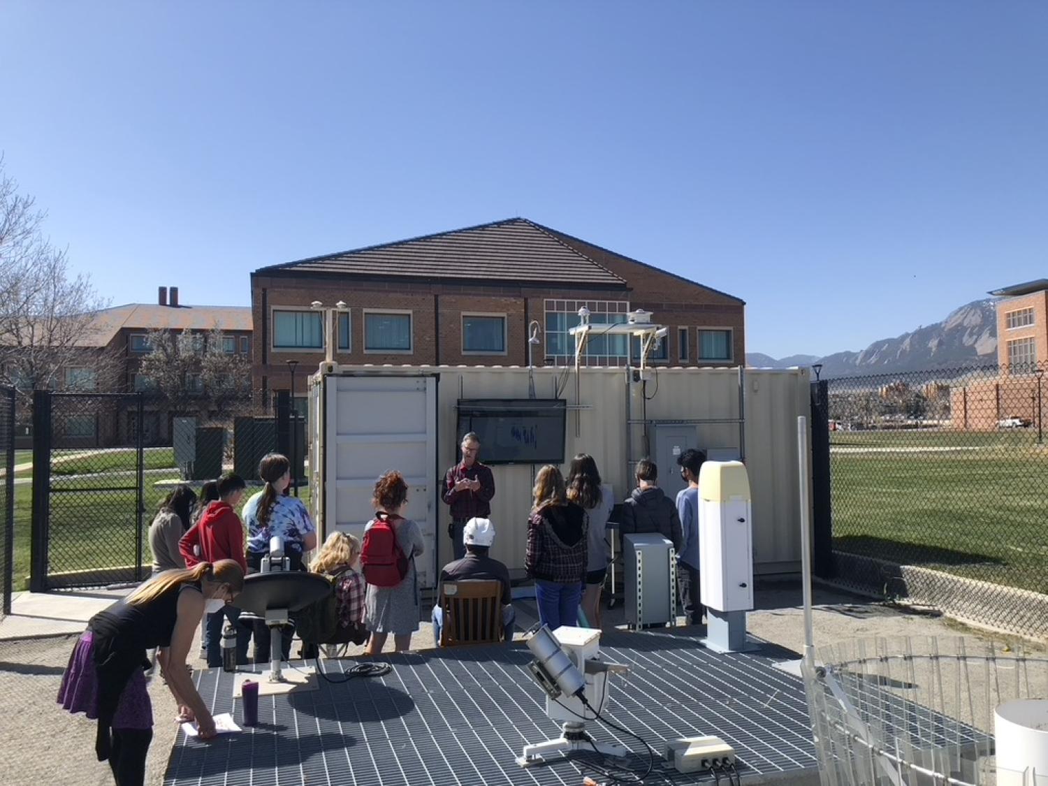 Students learn about Skywatch, a outdoor atmospheric observatory