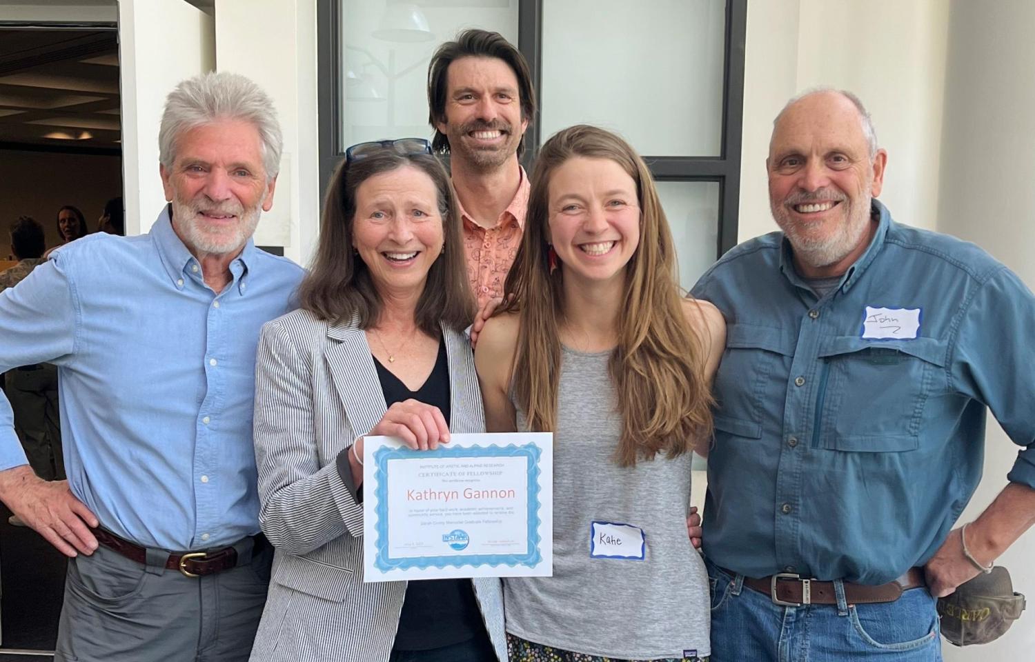 Group photo. After receiving her fellowship at the 2024 INSTAAR celebration luncheon, Katie Gannon is flanked by Sarah Crump's parents, Liz Anderson and John Crump, as well as Sarah's advisor Giff Miller (far left) and Sarah's partner, Nodin de Saillan (top)