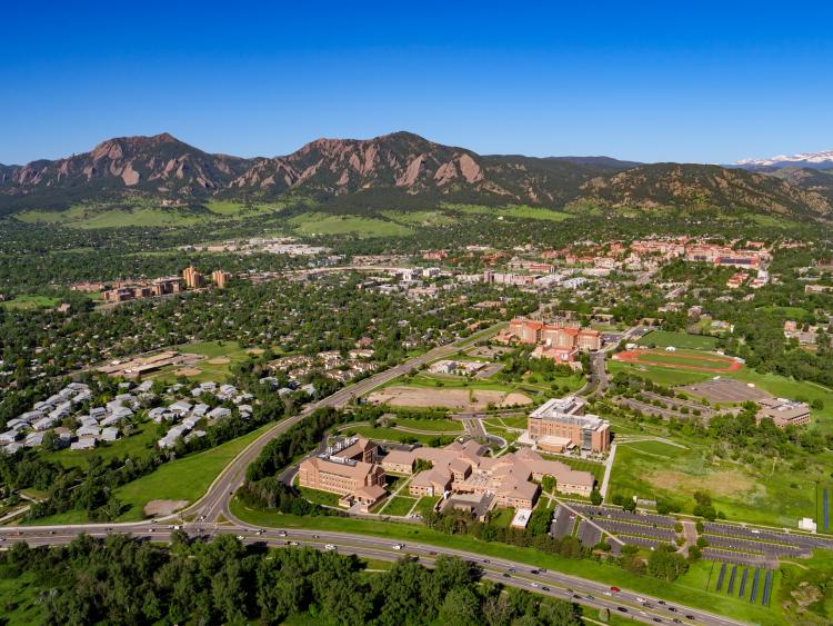 Aerial photo with SEEC buildings in foreground, main campus behind, and mountains in back