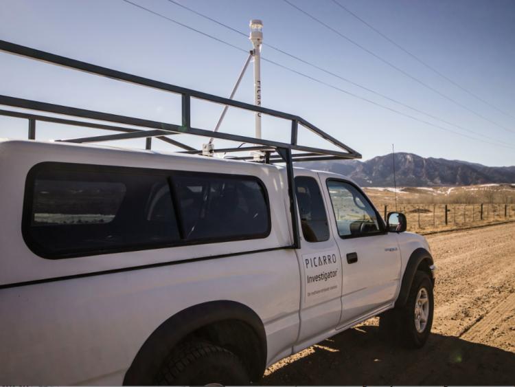 The Mobile Methane Analyze mounted on a white truck with white cab. Photo by Christi Turner.