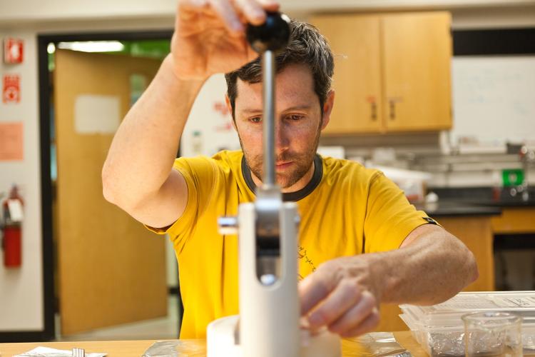 Chad Wolak packs samples. Photo by Ethan Welty