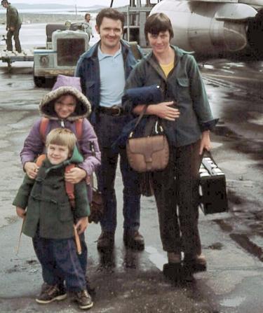 Two parents and their two kids pose for a photo on an airport runway in remote arctic Candada in 1975