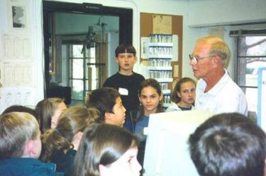 Kihl talks with students about sediment particle size during one of INSTAAR's first open houses for middle school students
