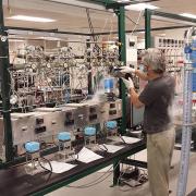 Researcher Chad Wolak prepares NOAA air samples for carbon-14 measurement. Photo by Scott Lehman.