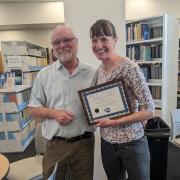 Bruce Vaughn presents Sylvia Michel with the Outstanding PRA Award.