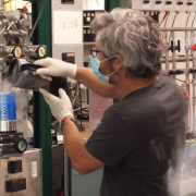 Chad Wolak prepares NOAA air samples for carbon-14 measurement.