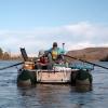 Mike Gooseff rows and Conor Newman takes samples while rafting the upper Colorado River to survey water quality.
