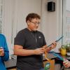 Three young teens hold long metal scientific instruments in a well-lit indoor laboratory. Photo by Gabe Allen, INSTAAR communications specialist.