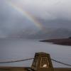 Rainbow visible over Lake Oroville from the top of Oroville Dam in Butte County California.