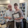 Bruce Vaughn presents Sylvia Michel with the Outstanding PRA Award.