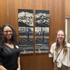 Holly Barnard and artist Jocelyn Catterson an artwork by Catterson in the Lieutenant Governor's office at the Colorado State Capitol building.
