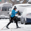 A cross-coutry skier navigates a Denver intersection on Wednesday, Jan. 18. Wet snows produced by an atmospheric river brought snowfall to the Rockies. AP Photo by David Zalubowski.