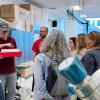 Sylvia Michel explains how analyzing ice cores can tell us about past climatic conditions as Dairy Arts Center curator Drew Austin holds a section of teaching ice.