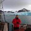 Tyler Jones on the deck of a research vessel.