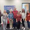 INSTAAR Front Office staff pose for a group photo during a meet-and-greet event in February 2024