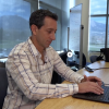 Noah Molotch looks at snowpack data for Colorado on his laptop.