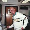 Rolf Kihl, with thick glasses, works in the Sed Lab while wearing his cherished CU Buffs sweater.