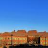 The SEEC building glows in afternoon sunlight.
