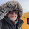 A bearded Bruce Vaughn in a very furry parka and sunglasses