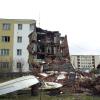 The corner of a Russian apartment building is collapsed from uneven permafrost thaw in Chersky. Photo by Vladimir Romanovsky, University of Alaska Fairbanks