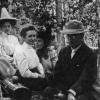1909 black and white image of Dr. Francis Ramaley and Dr. Caldwell (right) with a class in the forest near the Mountain Research Station