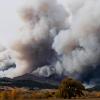 Plumes of smoke pour out from the Colorado foothills from the Calwood Fire