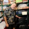 Mark Williams stands in a walk-in freezer with samples.