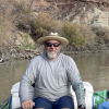 Mike Gooseff rows a raft on the Colorado River during field work.